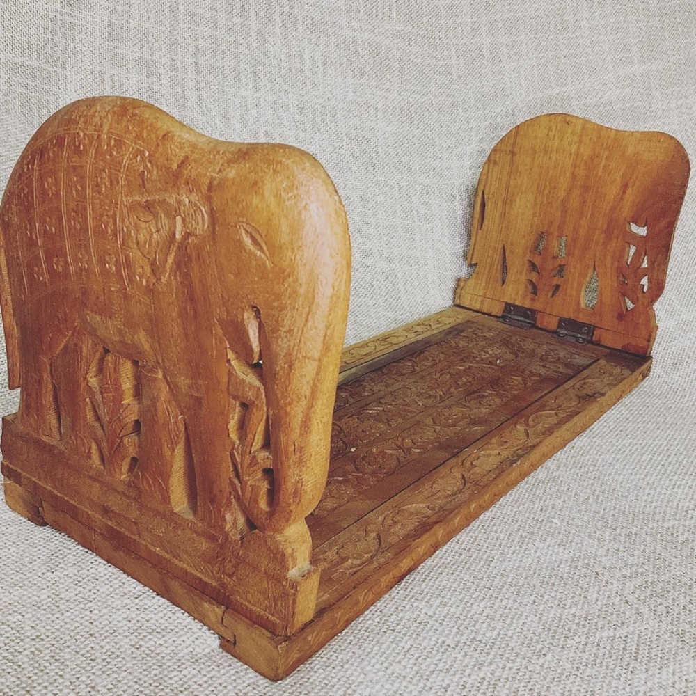 Vintage wood carved elephant expandable book rack.